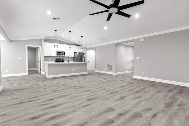 Vaulted ceilings, soft and neutral paint palette, kithen island - the 
