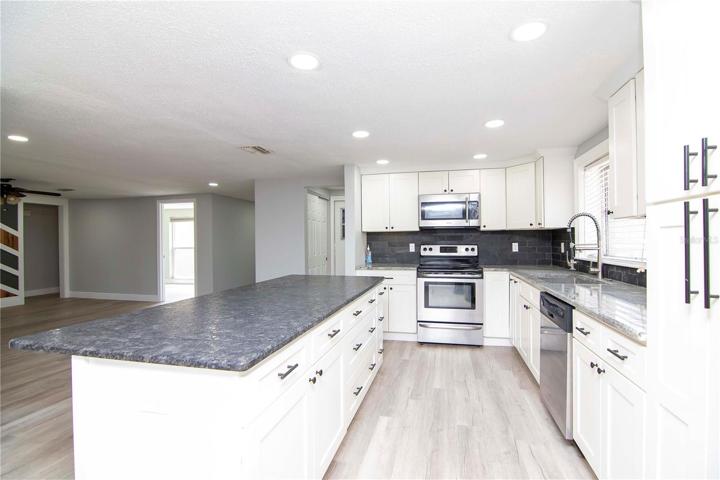 Solid wood cabinets with soft close and Stainless Steel appliances