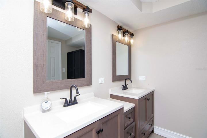 Master Bathroom with dual vanity sinks and shower/tub combo