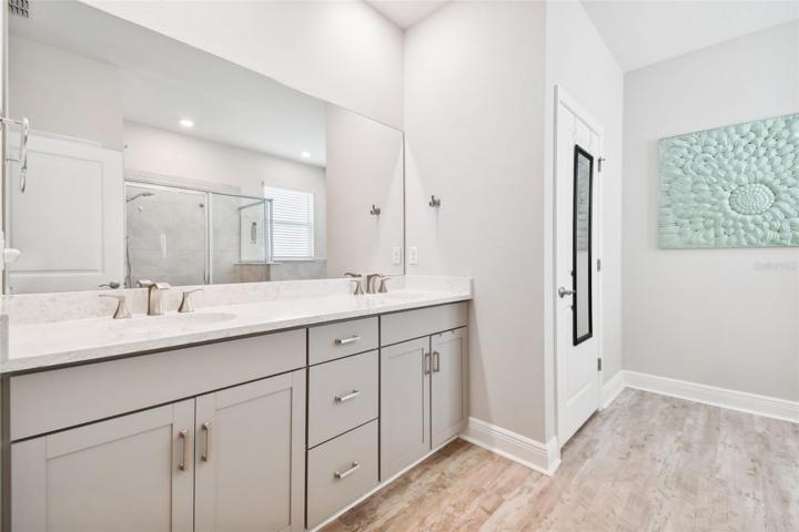 Spacious and luxurious master bath. Over-sized vanity with double sinks and designer fixtures.