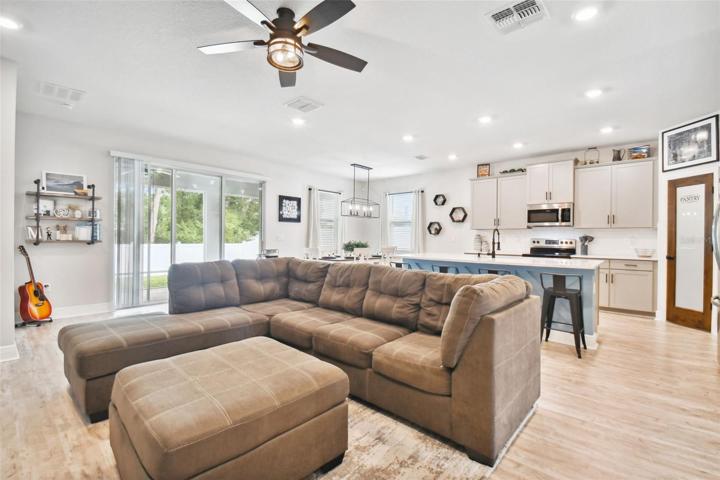 Spacious great room. Luxury vinyl flooring. High ceilings. Recessed lights.