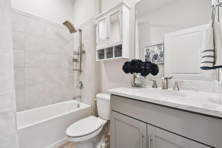 Full shared bath for the front two secondary bedrooms. Tub/shower combo. Large vanity with quartz counter.