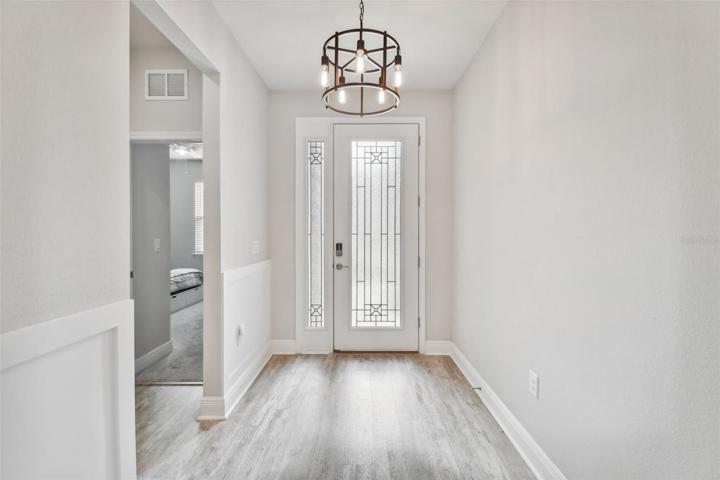 To the right, as you enter, are two secondary bedrooms with a shared full bath.