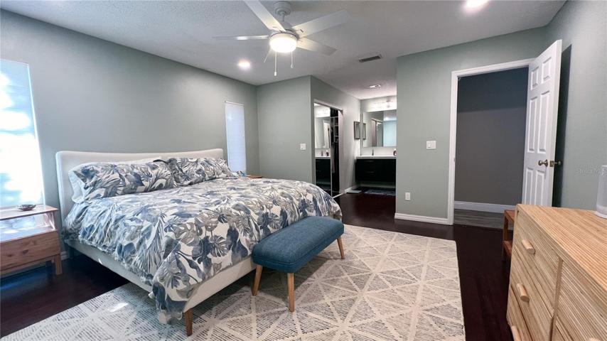 Owner's suite with custom California walk-in closet and vanity