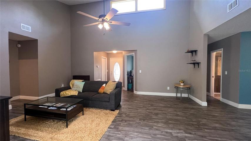 Living Room with lots of natural light looking at the front door