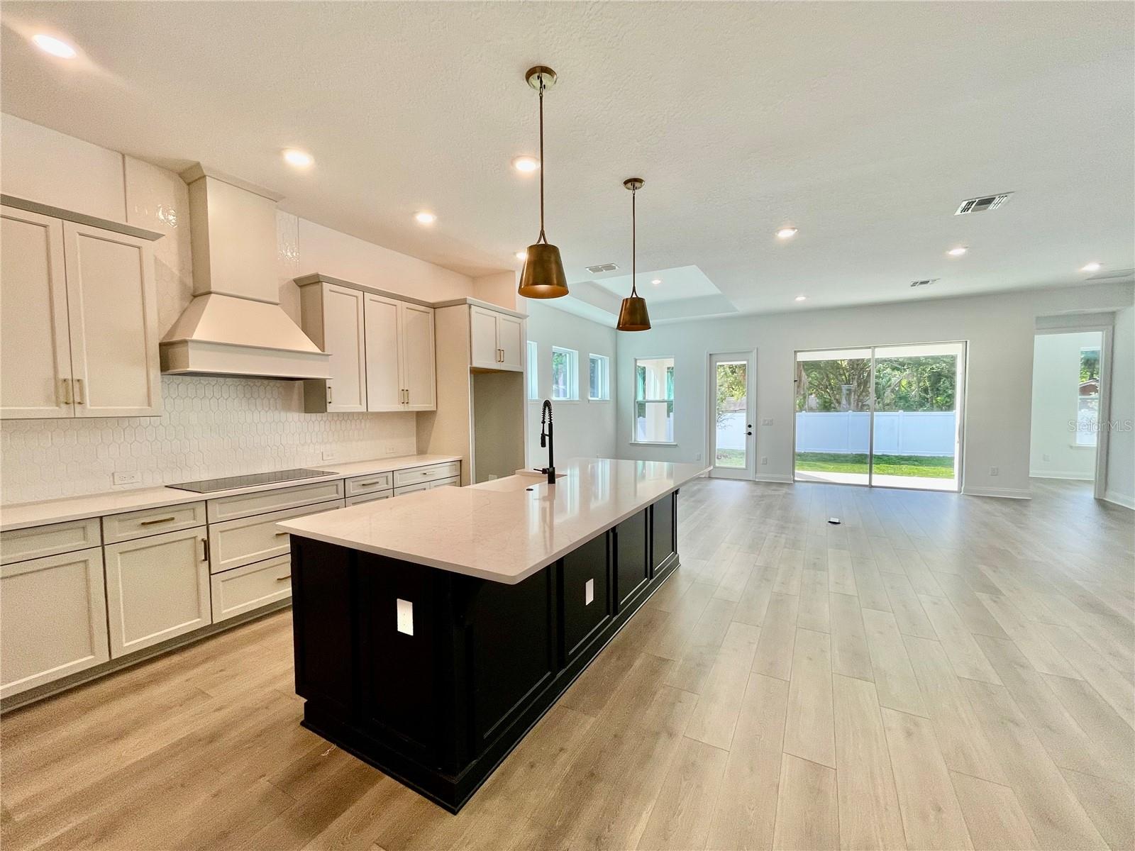 Kitchen looking into Living Room And Dining Room