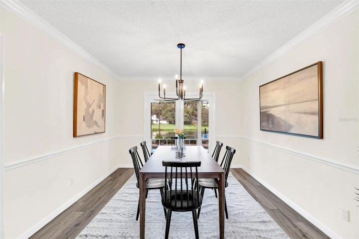Dining room newer double pane French doors to Lanai for unbelievable water views & seamless indoor/outdoor entertaining