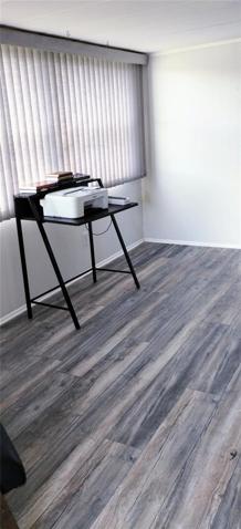 Flex room could be used as an office, den or extra living space.
