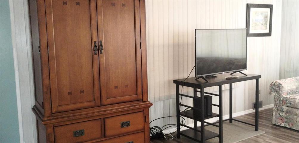 Living Room - Nice wood armoire stays