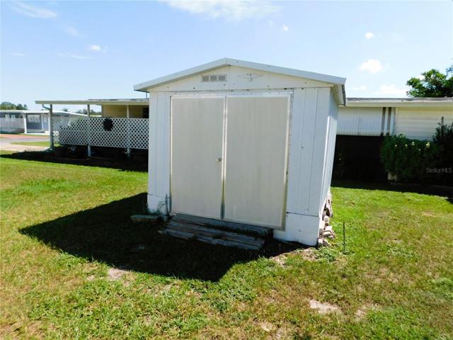 Golf cart storage shed.