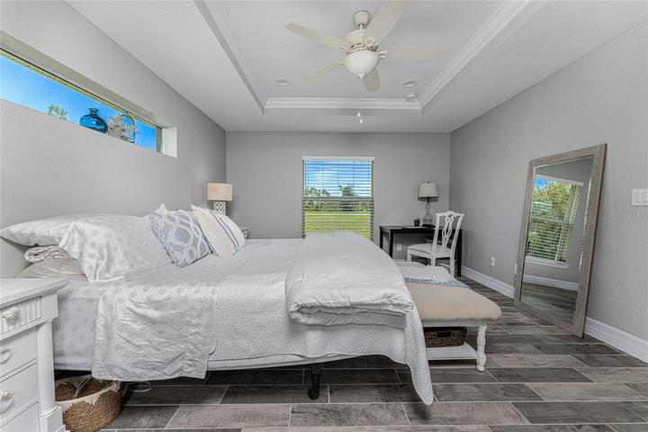 Pretty transom window over the bed area to take advantage of natural lighting