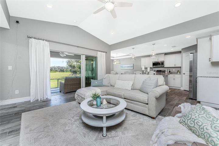 Living area has sliding glass doors opening onto the lanai