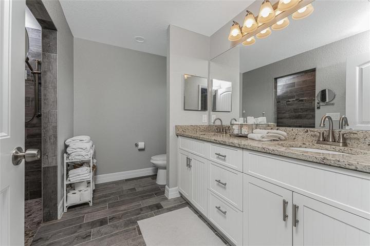 Master bath features an oversized vanity with granite countertop and double basins!
