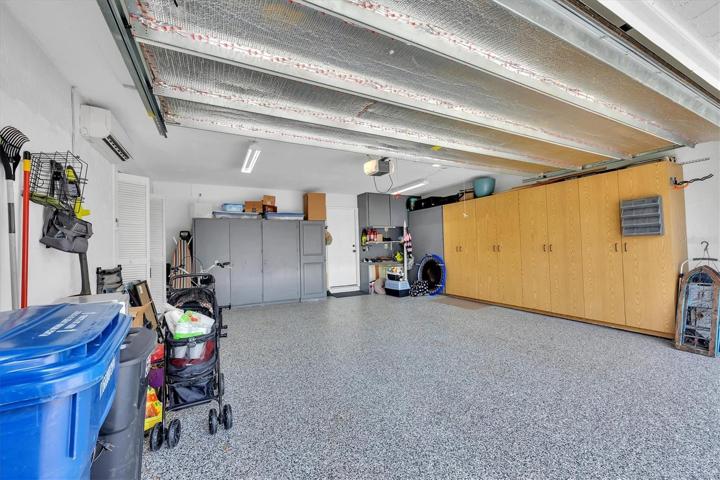 Roomy, air-conditioned garage with durable decorative floor coating