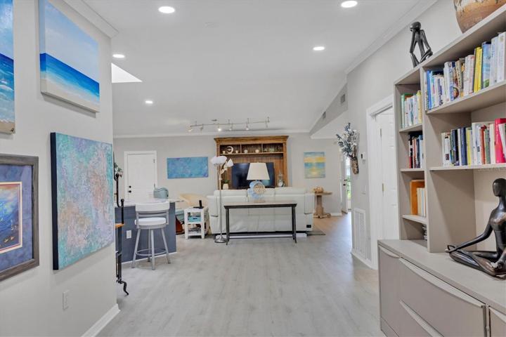 Open area leading to the bonus room- perfect for a piano, bookshelves, etc.