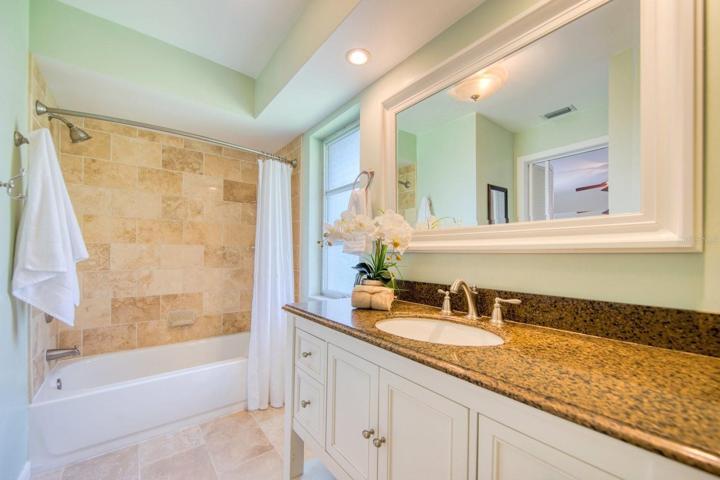Updated en suite with cabinet storage & counter space for two~