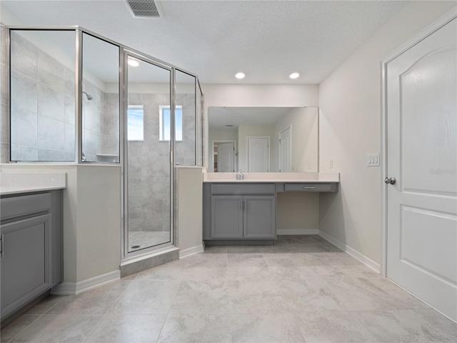 Primary Bath with Spa-like Walk-in Shower and Split Vanities