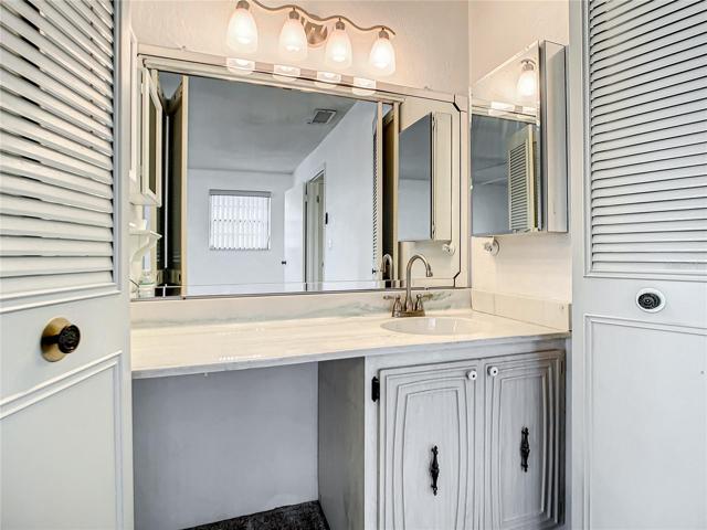 Primary bedroom has sink area.
