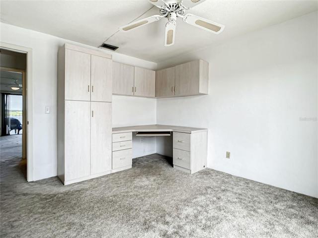 Built in desk and cabinetry in second bedroom.