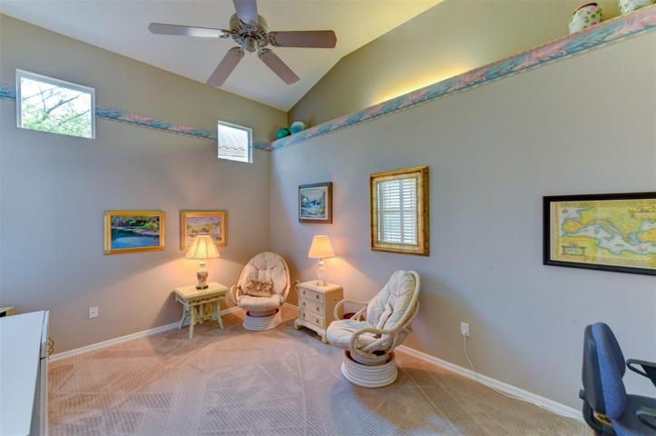Flex/office or den room with a ceiling fan