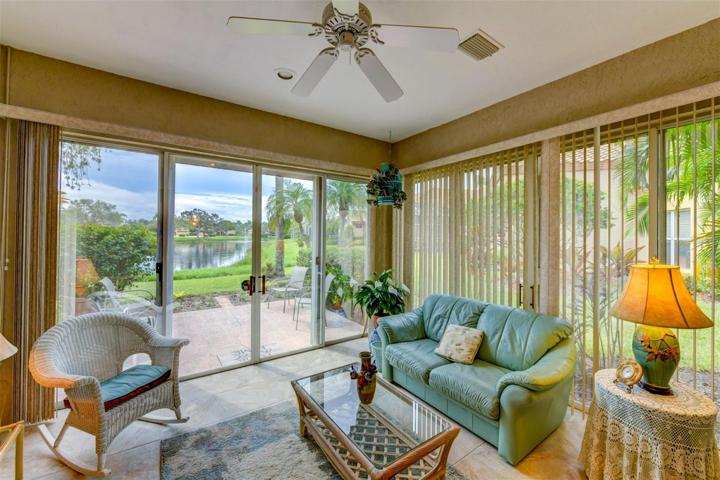 Enclosed patio with a ceiling fan