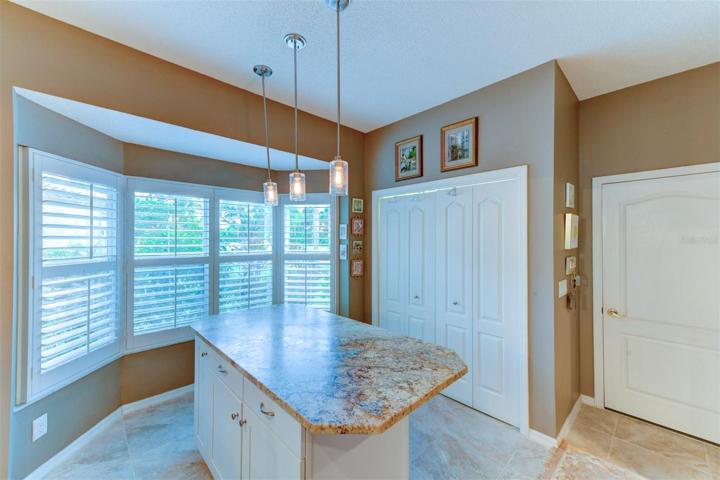 Modern light fixture above the island in the kitchen