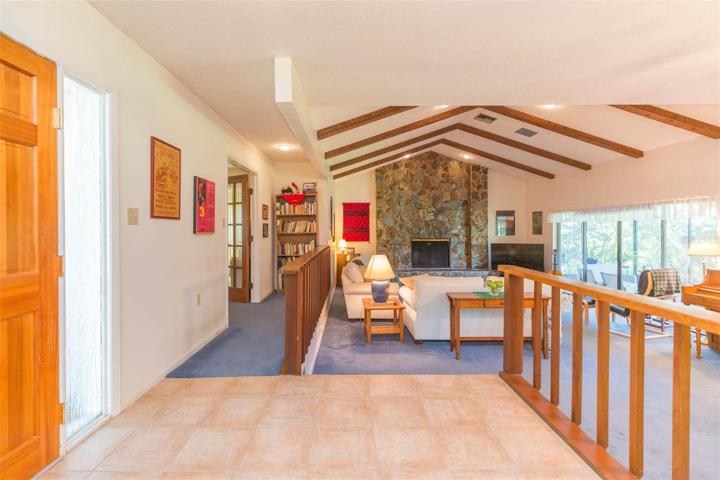 Foyer overlooking grand living room.