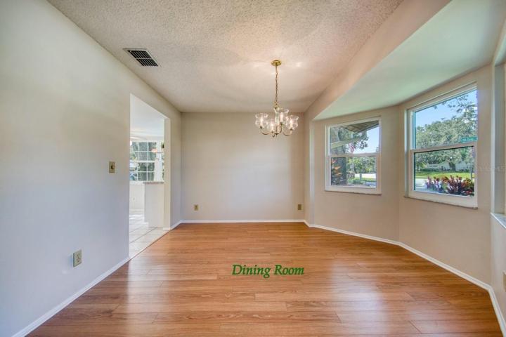 Dining room with bay shaped window wall feature~