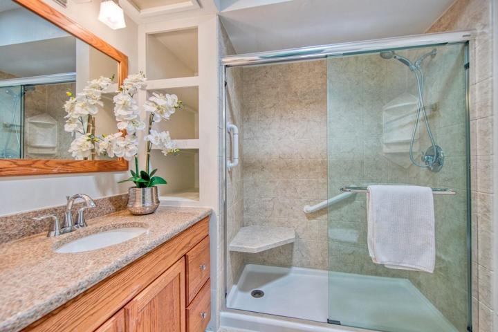 Updated master bathroom with step in shower & sturdy doors with extra storage for linens~