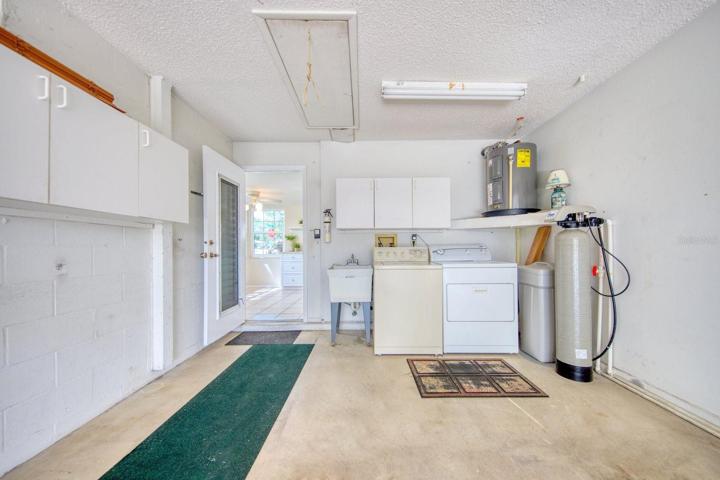 Oversize garage with laundry station & cabinets is big enough for your car and a golf cart~