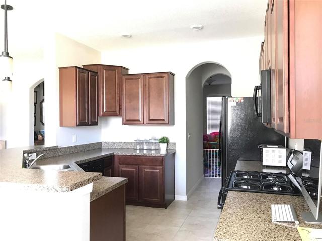 Kitchen showing through of butler's pantry to dinning area