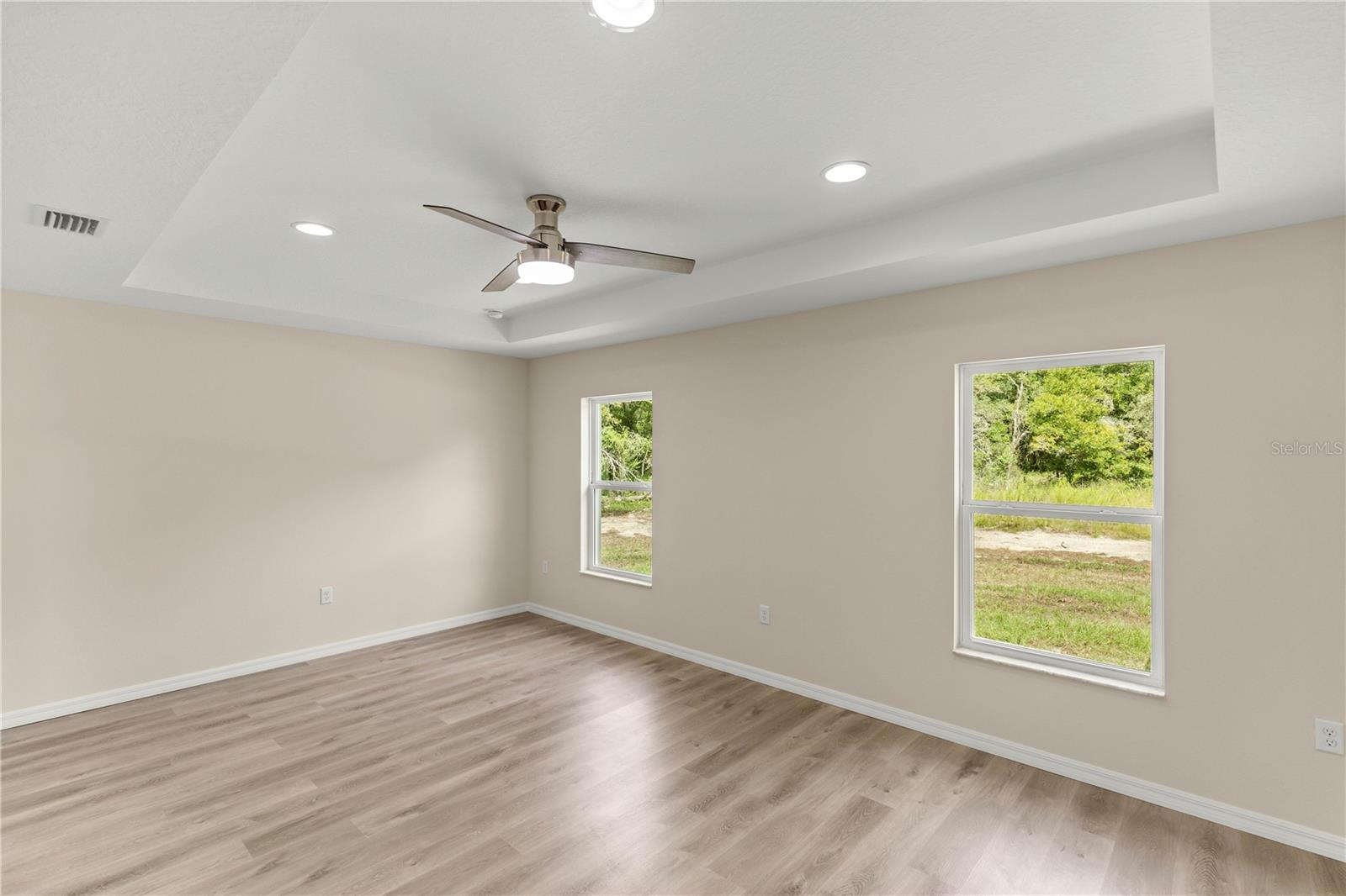 PRIMARY SUITE WITH TRAY CEILINGS
