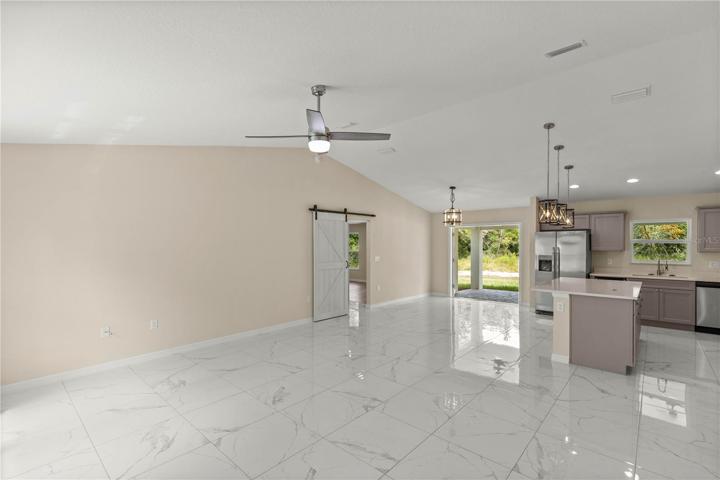 LIVING ROOM WITH VAULTED CEILING