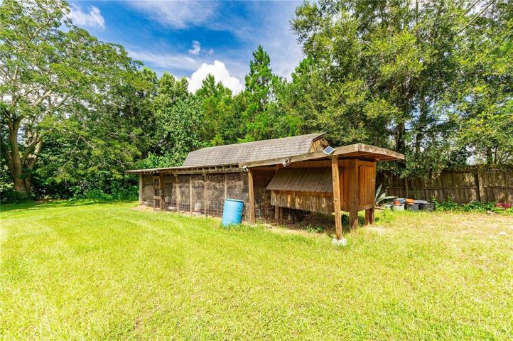 Chicken coop and barn are included with this home.