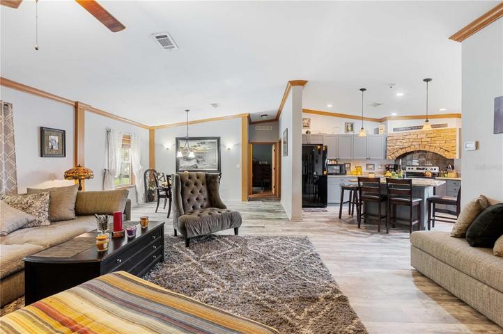 Living room is open with dining area, kitchen, and is great for entertaining.