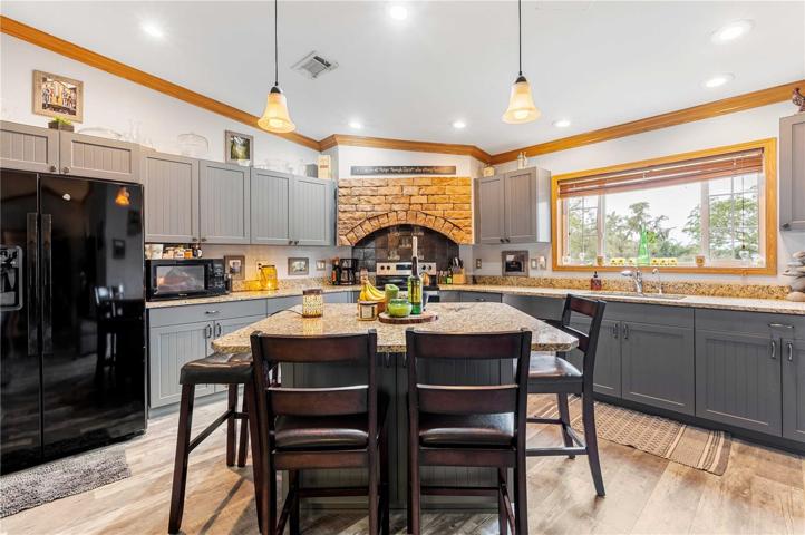 Kitchen has newly updated center island with Granet counter tops.