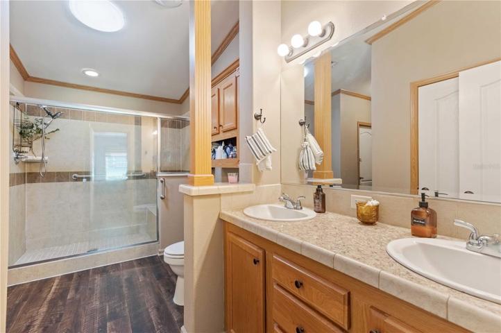 Master retreat has double vanity, large tile step-in shower, and plenty of closet space.