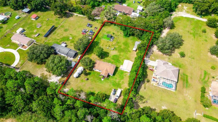 This incredible homestead has fenced yard, barn, detached two car garage, chicken coops and so much more!