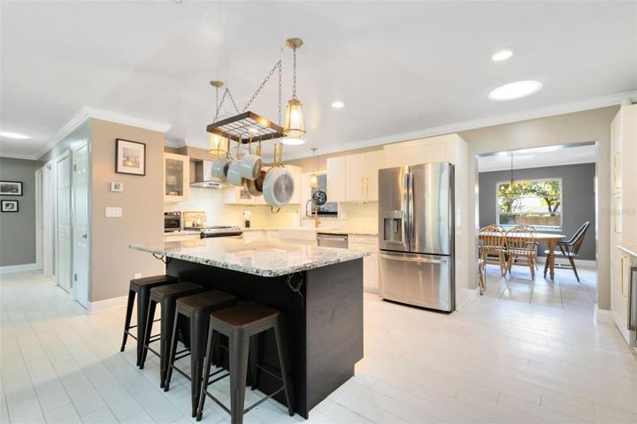 A beauiful view of the kitchen and into the living room/dining room combo.