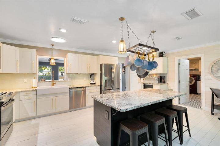 The kitchen boasts beautiful updates and modern amenities.