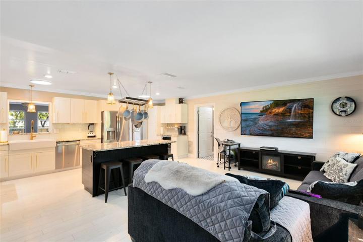 Step through the front door, and you'll be greeted by a spacious and inviting family room and kitchen combo.