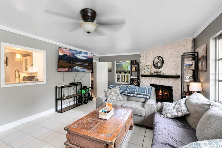 This space offers a delightful view of the pool and features a pass-through window from the kitchen, perfect for serving up movie night or game day snacks.