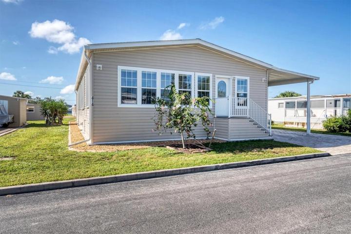 414 Vasto Dr. is located in Venice Isle in Venice, a 55+ manufactured home park.