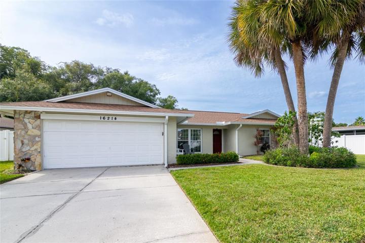 Two car garage and mature landscaping