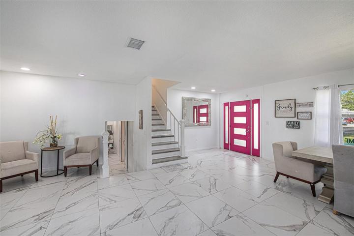 Entrance and View of Stairs to 3rd Floor