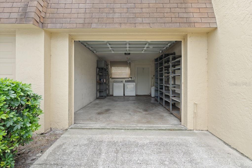 One car garage with washer/dryer and garage door opener