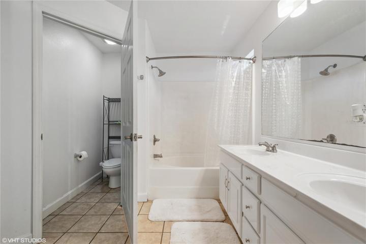 Double sink vanity and water closet