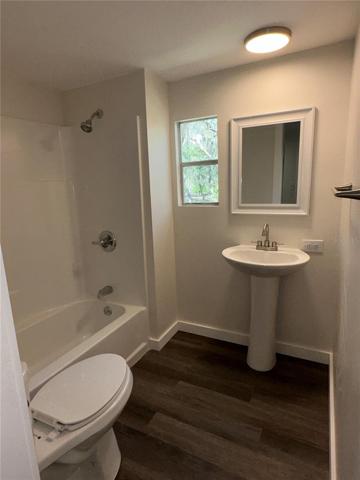 guest bathroom with tub/shower combo