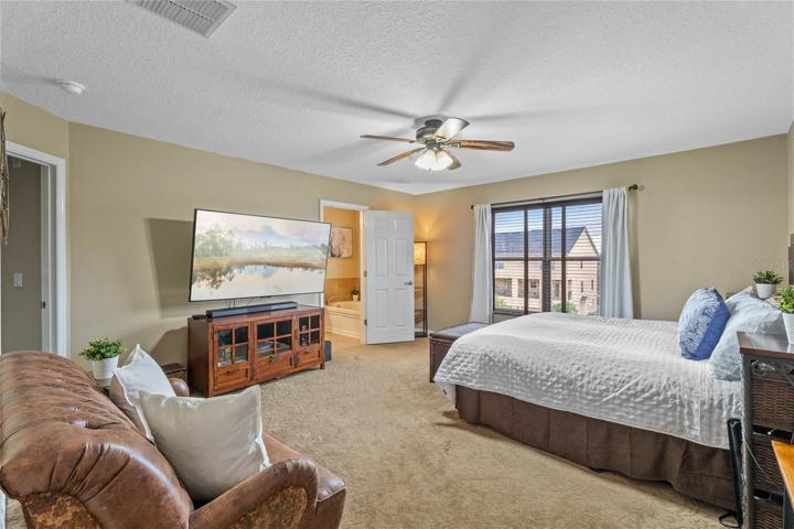 Master bedroom w/ windows that let the natural light in!