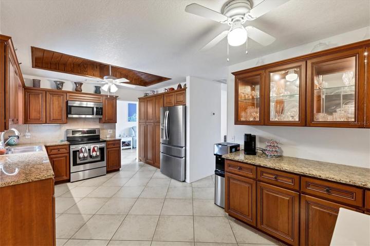 "buffet style" cabinets with overhead glass fronts - room for eat in nook (top freezer only partially shown far right included)